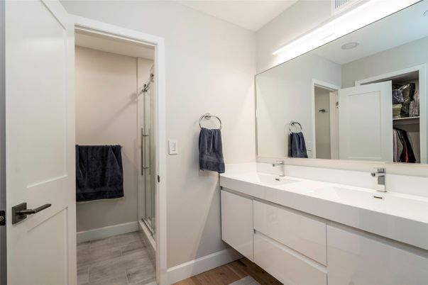 Bathroom, Dual Sink Vanities, Glass Shower, Interior, Wood Texture Flooring