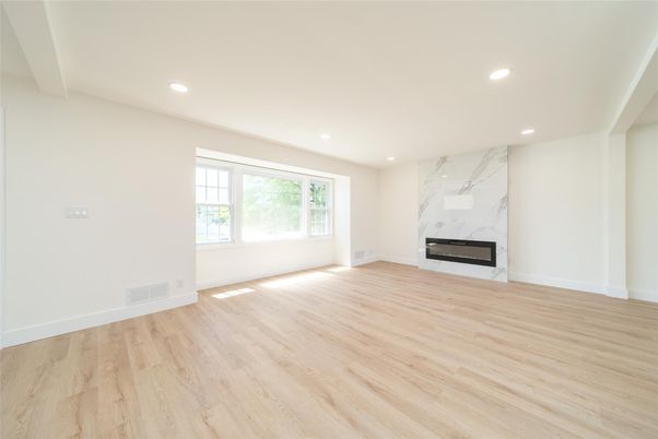 Empty room, Fireplace, Interior, Marble Walls, Recessed Lighting, Wood Texture Flooring