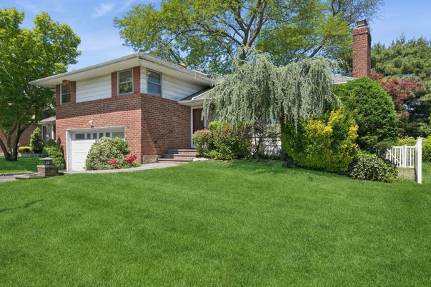 Attached, Backyard, Exterior, Facade, Brick Facade, Split Level