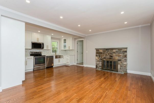 Fireplace, Interior, Kitchen, Recessed Lighting, Stainless Steel Appliances, Wood Texture Flooring