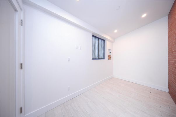 Empty room, Interior, Recessed Lighting, Stone Walls, Wood Texture Flooring
