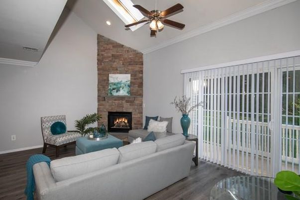 Fireplace, Interior, Living room, Recessed Lighting, Stone Walls, Wood Texture Flooring