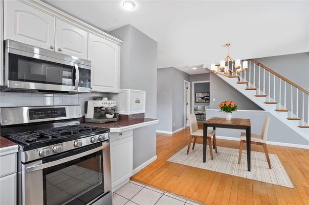 Chandelier, Dining room, Interior, Kitchen, Recessed Lighting, Stainless Steel Appliances, Wood Texture Flooring