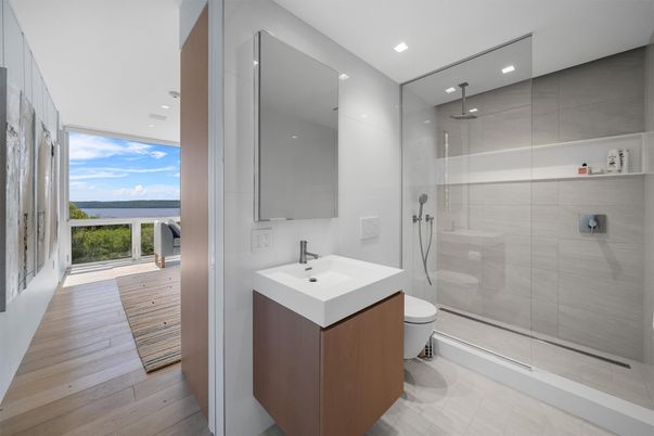 Bathroom, Glass Shower, Interior, Recessed Lighting, Water, Wood Texture Flooring