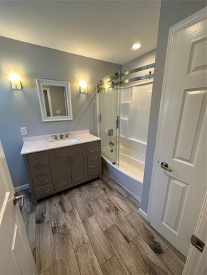 Bathroom, Dual Sink Vanities, Glass Shower, Interior, Recessed Lighting, Wood Texture Flooring