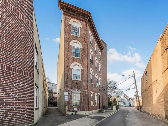 Exterior, Facade, Brick Facade, Condo Building