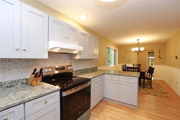 Chandelier, Dining room, Interior, Kitchen, Recessed Lighting, Stainless Steel Appliances, Wood Texture Flooring