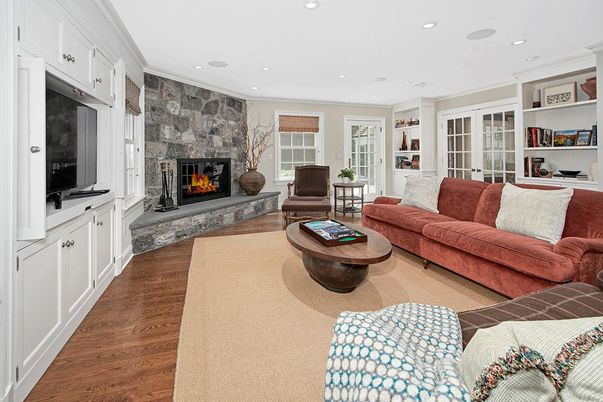 Fireplace, Interior, Living room, Recessed Lighting, Stone Walls, Wood Texture Flooring