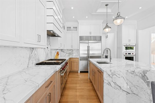 Interior, Kitchen, Marble Walls, Pendant Lights, Recessed Lighting, Stainless Steel Appliances, Wood Texture Flooring