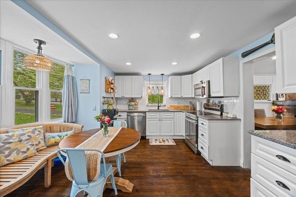 Dining room, Interior, Kitchen, Pendant Lights, Recessed Lighting, Stainless Steel Appliances, Wood Texture Flooring