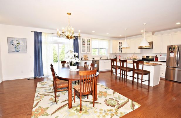Chandelier, Dining room, Interior, Kitchen, Pendant Lights, Recessed Lighting, Stainless Steel Appliances, Wood Texture Flooring