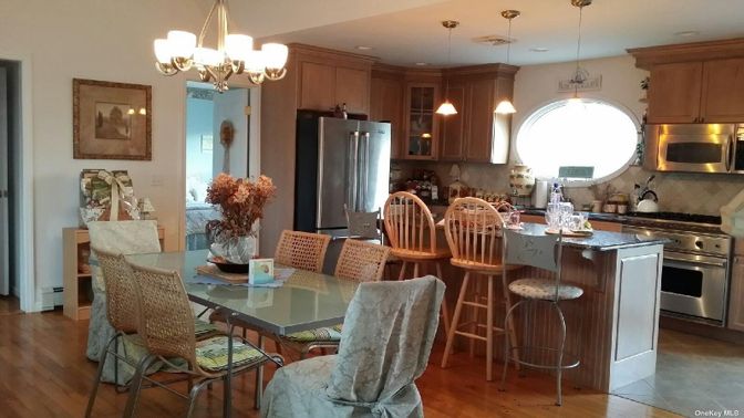 Chandelier, Dining room, Interior, Kitchen, Pendant Lights, Recessed Lighting, Stainless Steel Appliances, Wood Texture Flooring