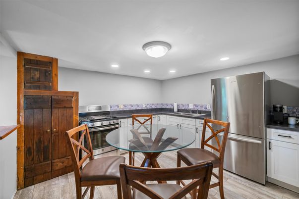 Dining room, Interior, Kitchen, Recessed Lighting, Stainless Steel Appliances, Wood Texture Flooring