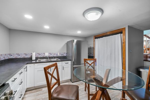Dining room, Interior, Kitchen, Recessed Lighting, Stainless Steel Appliances, Wood Texture Flooring