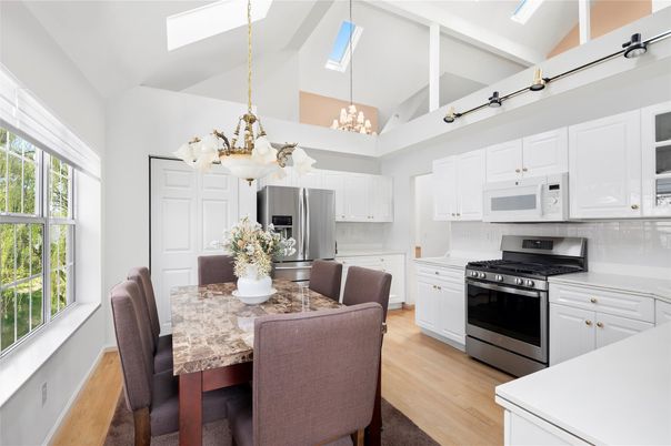 Chandelier, Dining room, Interior, Kitchen, Pendant Lights, Stainless Steel Appliances, Wood Texture Flooring