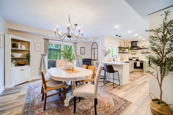 Chandelier, Dining room, Interior, Kitchen, Pendant Lights, Recessed Lighting, Stainless Steel Appliances, Wood Texture Flooring