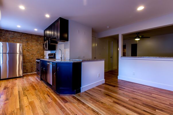 Interior, Kitchen, Recessed Lighting, Stainless Steel Appliances, Stone Walls, Wood Texture Flooring