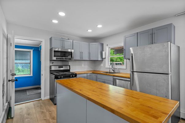 Interior, Kitchen, Recessed Lighting, Stainless Steel Appliances, Wood Texture Flooring