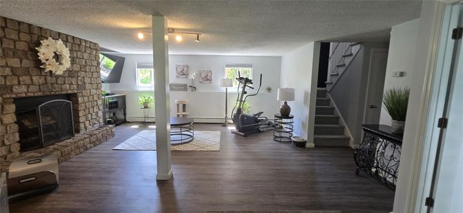 Fireplace, Fitness Equipment, Interior, Stone Walls, Wood Texture Flooring