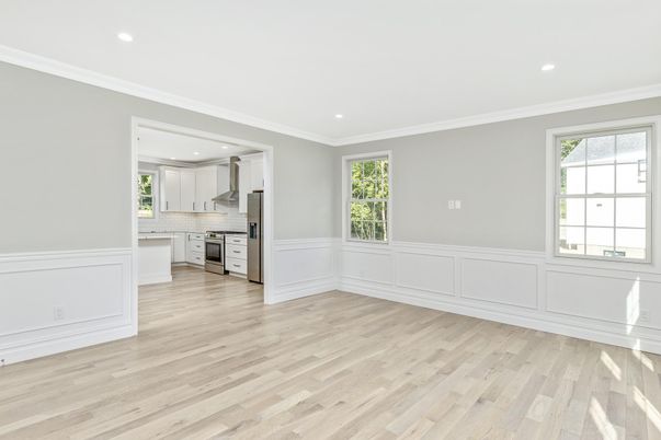 Empty room, Interior, Kitchen, Recessed Lighting, Stainless Steel Appliances, Wood Texture Flooring