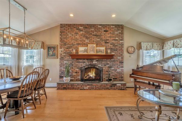 Dining room, Fireplace, Interior, Pendant Lights, Piano, Recessed Lighting, Stone Walls, Wood Texture Flooring