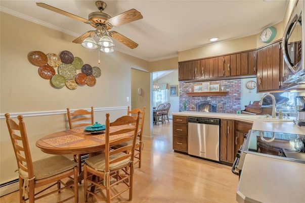 Dining room, Interior, Kitchen, Recessed Lighting, Stainless Steel Appliances, Stone Walls, Wood Texture Flooring