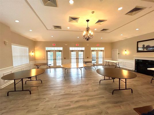 Chandelier, Fireplace, Game Room, Interior, Recessed Lighting, Wood Texture Flooring