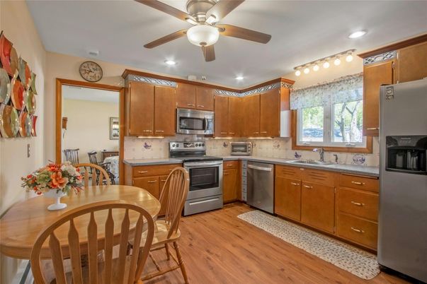 Dining room, Interior, Kitchen, Recessed Lighting, Stainless Steel Appliances, Wood Texture Flooring