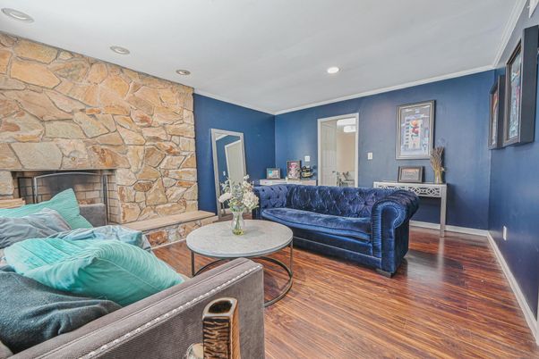 Fireplace, Interior, Living room, Recessed Lighting, Stone Walls, Wood Texture Flooring