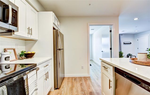 Interior, Kitchen, Recessed Lighting, Stainless Steel Appliances, Wood Texture Flooring