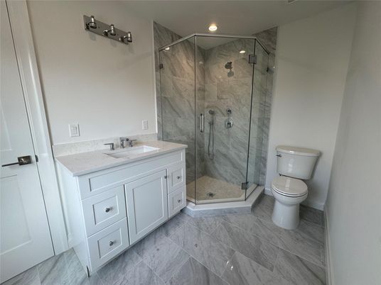 Bathroom, Dual Sink Vanities, Glass Shower, Interior, Marble, Marble Walls, Recessed Lighting