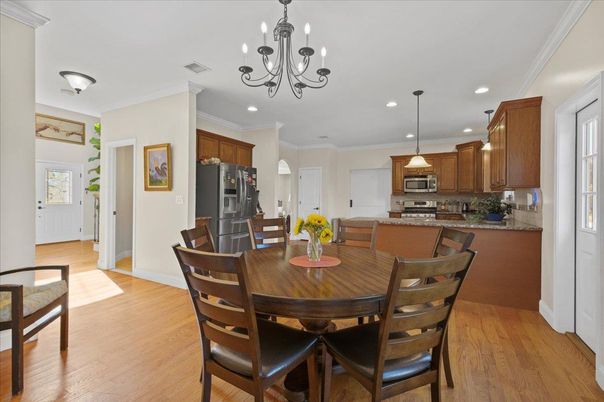 Chandelier, Dining room, Interior, Kitchen, Recessed Lighting, Stainless Steel Appliances, Wood Texture Flooring