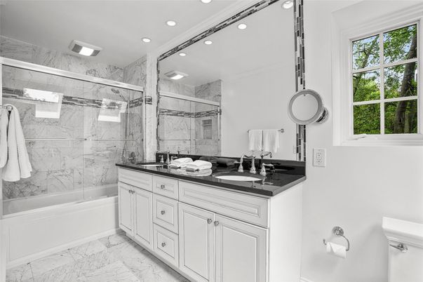 Bathroom, Dual Sink Vanities, Glass Shower, Interior, Marble, Marble Walls, Recessed Lighting