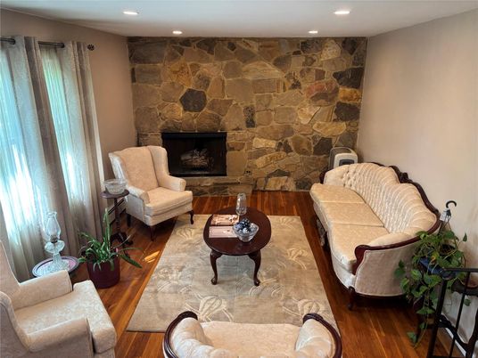 Fireplace, Interior, Living room, Recessed Lighting, Stone Walls, Wood Texture Flooring