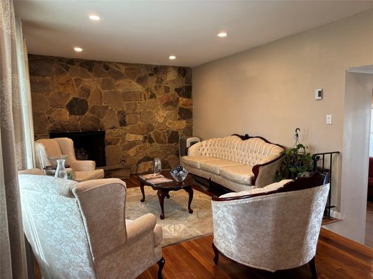 Fireplace, Interior, Living room, Recessed Lighting, Stone Walls, Wood Texture Flooring