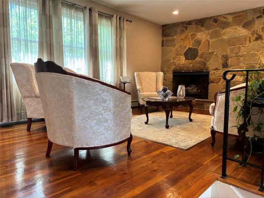 Fireplace, Interior, Living room, Recessed Lighting, Stone Walls, Wood Texture Flooring