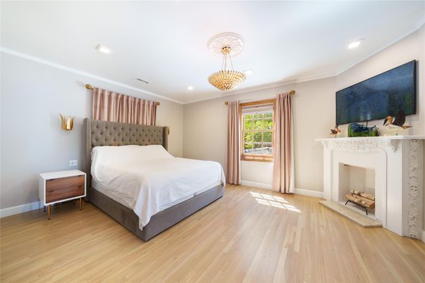 Bedroom, Chandelier, Fireplace, Interior, Recessed Lighting, Wood Texture Flooring
