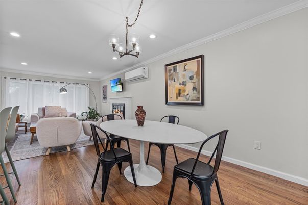 Chandelier, Dining room, Fireplace, Interior, Living room, Recessed Lighting, Wood Texture Flooring