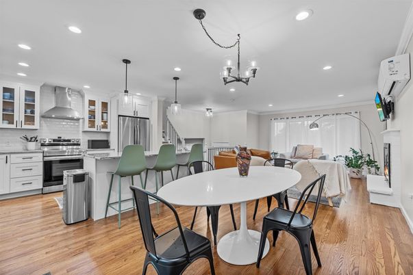 Chandelier, Dining room, Interior, Kitchen, Pendant Lights, Recessed Lighting, Stainless Steel Appliances, Wood Texture Flooring
