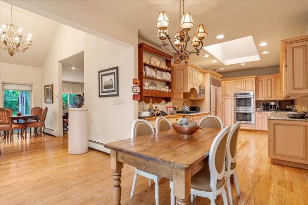 Chandelier, Dining room, Interior, Kitchen, Recessed Lighting, Stainless Steel Appliances, Wood Texture Flooring