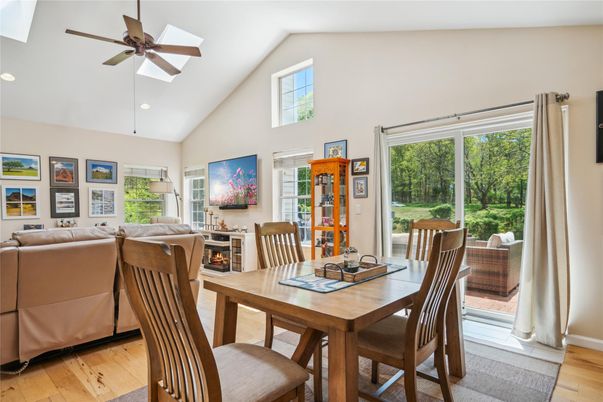 Dining room, Fireplace, Interior, Living room, Recessed Lighting, Wood Texture Flooring