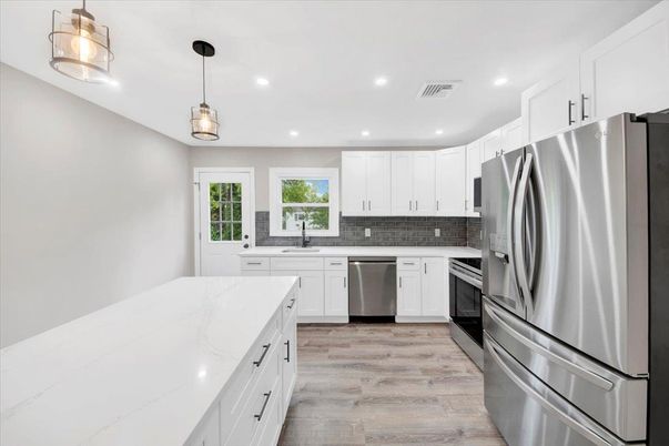 Interior, Kitchen, Pendant Lights, Recessed Lighting, Stainless Steel Appliances, Wood Texture Flooring