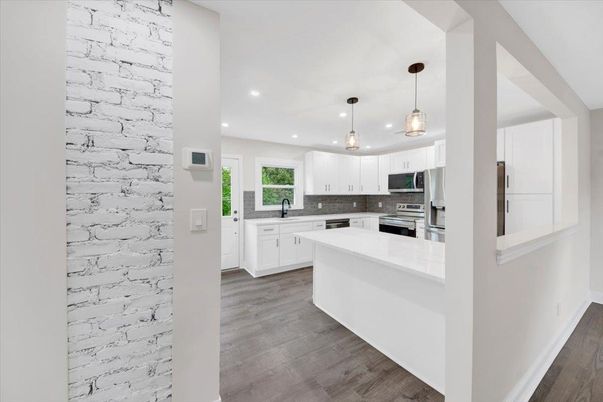 Interior, Kitchen, Pendant Lights, Recessed Lighting, Stainless Steel Appliances, Stone Walls, Wood Texture Flooring