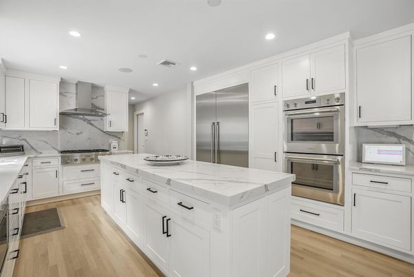 Interior, Kitchen, Marble Walls, Recessed Lighting, Stainless Steel Appliances, Wood Texture Flooring