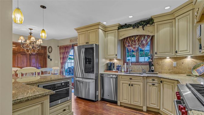 Chandelier, Interior, Kitchen, Pendant Lights, Recessed Lighting, Stainless Steel Appliances, Wood Texture Flooring