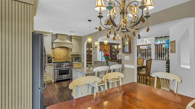 Chandelier, Dining room, Interior, Kitchen, Pendant Lights, Recessed Lighting, Stainless Steel Appliances, Wood Texture Flooring