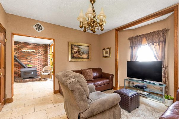 Chandelier, Fireplace, Interior, Living room, Stone Walls