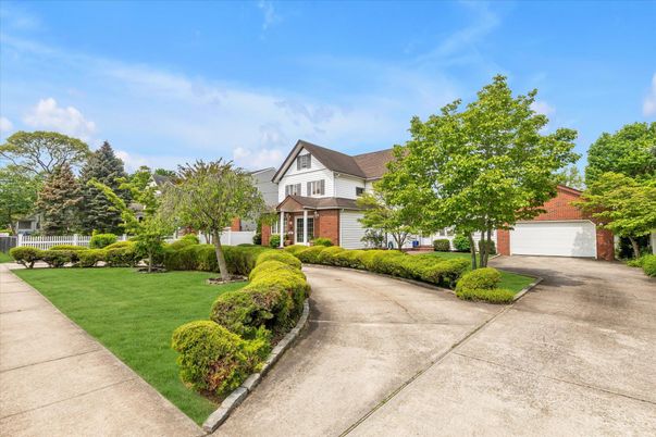 Attached, Backyard, Detached Garage, Exterior, Facade, Brick Facade, Tudor Revival