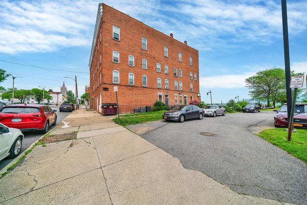 Exterior, Facade, Brick Facade, Condo Building