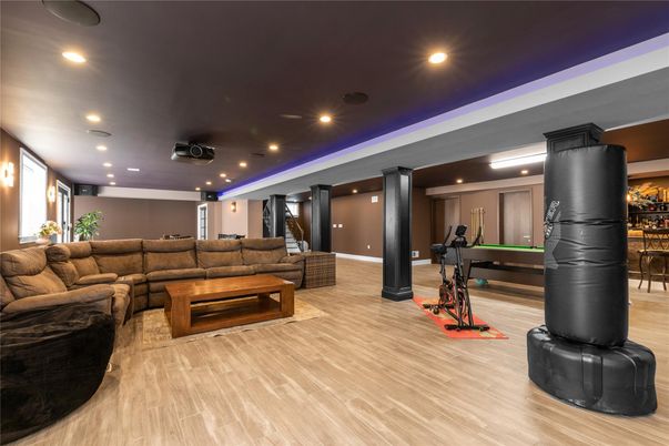 Billiard Table, Fitness Equipment, Game Room, Interior, Living room, Recessed Lighting, Wood Texture Flooring